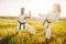 Two female karate in kimono training combat skill