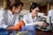 Two female laborant researchers preparing samples