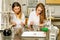 Two female laboratory technicians researching medical samples and reagents for coronavirus vaccination