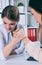 Two female office wokers armwrestling, exerting pressure on each other, struggling for leadership.