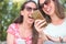 Two female persons looking at smartphone enjoyed happy and smiling by social media new exciting event friendship concept lifestyle