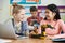 Two Female Pupils In Science Lesson Studying Robotics