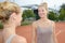 Two female runners ready to race at running track