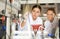 Two female scientists conduct a chemical experiment together and write down test results