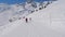 Two Female Skiers Skiing Down The Ideal Slope Of The Mountain In Winter