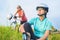 Two female sport athletes resting together outdoors.