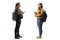 Two female students with books and backpacks having a conversation