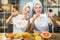 Two female teenagers using vitamin mask for face at home