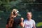 Two female tennis players shaking hands with smiles on a sunny day, exuding sportsmanship and friendship after a