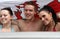 Two females and one male in a jacuzzi