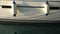 Two fenders on white sailing yacht moored at marina Portorosa