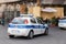 Two Fiat Grande Punto police cars of the Polizia Locale City Police at Piazza del Duomo in Catania, Sicily, Italy