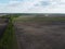 Two fields separated by a forest belt, aerial view. Agricultural landscape