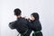 Two fighters in pencak silat Hitam uniform fight in a push