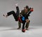 Two fighting guys in kimono and boxing gloves during battle, knockout, martial arts, mixed fight concept