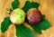 Two figs with leaf wooden background.