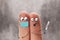 Two fingers as two men, cartoon characters. One of them is wearing a mask, the other is sick, holding a thermometer. Illustration