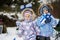 Two finnish sisters with Finland flags on a nice winter day. Nordic Scandinavian people