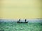 Two fisherman on fishing boat come home