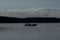Two fishermen on a boat on the Saimaa lake in Finland