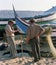 Two fishermen near boats in a small village of Portugal in the 80s