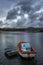 Two fishermen rafts moored with their anchors at the bottom of an estuary on the Galician coast of pontevedra