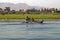 Two fishermen are in a small boat on the Nile river, Egypt