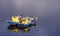 Two fishing boats floating on rippling water