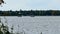 Two fishing boats on a lake in early autumn.