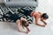 Two fit women standing in plank position on floor strengthening core muscles at home Top view