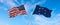 two flags of USA and state of Naval jack of the Confederate states of America waving in the wind on flagpoles against sky with