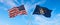 two flags of USA and state of Utah waving in the wind on flagpoles against sky with clouds on sunny day