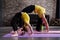 Two flexible girls of different age doing upward facing bow yoga pose working out