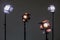 Two floodlights with halogen lamps and Fresnel lens and two led lighting device. Shooting in the interior on a gray background