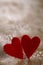 Two fluffy hearts on cracked painted background