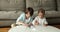 Two focused cute sibling children drawing in album papers