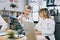 Two focused male and female medical workers examining results of x ray scan