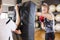 Two focused women boxing at the gym