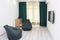 Two frameless gray armchairs with a TV and beech chest, Scandinavian design, bedroom, interior, minimalism