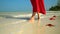 Two frames in video. Tropical white sand with red starfish in clear water. Starfish on phu quoc Island. The woman in a