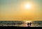 Two freinds silhouette meeting ocean sunset landscape backdrop