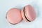 Two french desert pink macaron cakes top view