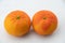 Two Fresh clementine citrus fruits