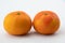 Two Fresh clementine citrus fruits