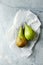 Two Fresh Conference Pears  on white Paper