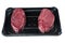 Two fresh fillet steaks on a plastic tray, Isolated on white. Meat and retail industry concept. Premium cut of beef