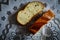 Two fresh pieces of white bread on the tablecloth