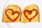 Two fried breads in the egg with hearts of ketchup, valentine food