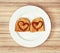 Two fried breads in the egg with hearts of ketchup, valentine food theme