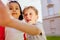 Two friendly dark-skinned and white children diverse positive boy and girl stand hugging. children concept